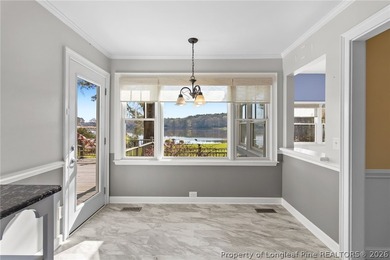 Stunning lakefront living awaits at 253 Lakeview Dr in the on Carolina Trace Country Club in North Carolina - for sale on GolfHomes.com, golf home, golf lot