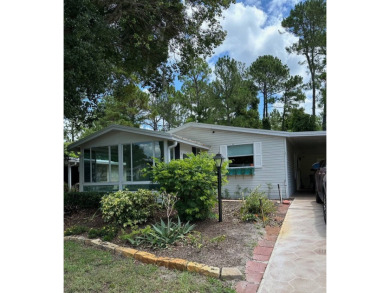 Manufactured Home on Leased Land with Lot Rent. Spacious 2 on Whisperwood Golf Course in Florida - for sale on GolfHomes.com, golf home, golf lot