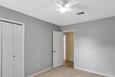 Located in the heart of Tiger Point, this 4-bedroom, 2-bath home on Tiger Point Golf and Country Club in Florida - for sale on GolfHomes.com, golf home, golf lot