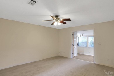 Located in the heart of Tiger Point, this 4-bedroom, 2-bath home on Tiger Point Golf and Country Club in Florida - for sale on GolfHomes.com, golf home, golf lot