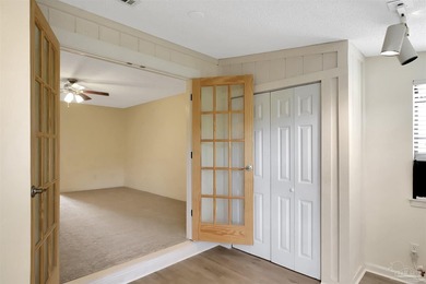 Located in the heart of Tiger Point, this 4-bedroom, 2-bath home on Tiger Point Golf and Country Club in Florida - for sale on GolfHomes.com, golf home, golf lot