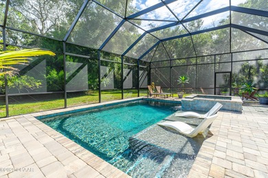 Stunning Halifax Plantation golf course custom pool home on a on Halifax Plantation Golf Club in Florida - for sale on GolfHomes.com, golf home, golf lot
