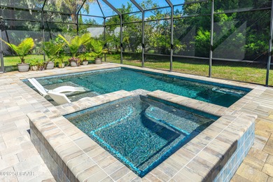 Stunning Halifax Plantation golf course custom pool home on a on Halifax Plantation Golf Club in Florida - for sale on GolfHomes.com, golf home, golf lot