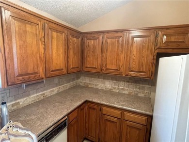 This perfect sized, two bedroom townhouse with Cathedral on Holiday Island Executive Golf Course in Arkansas - for sale on GolfHomes.com, golf home, golf lot