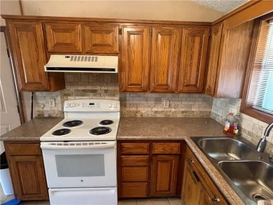 This perfect sized, two bedroom townhouse with Cathedral on Holiday Island Executive Golf Course in Arkansas - for sale on GolfHomes.com, golf home, golf lot