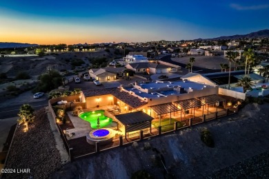 Nestled in the serene beauty of Lake Havasu City, this exquisite on London Bridge Golf Course in Arizona - for sale on GolfHomes.com, golf home, golf lot