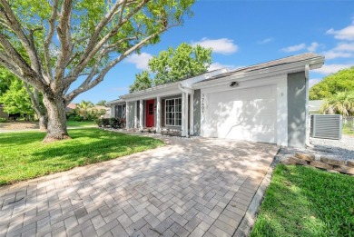 Welcome to 12401 Yorktown Lane, Bayonet Point, FL 34667. Step on Beacon Woods Golf Club in Florida - for sale on GolfHomes.com, golf home, golf lot