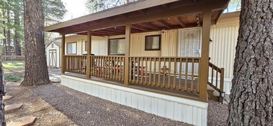 Tucked among the tall pines of Pinetop Lakes Country Club, this on Pinetop Lakes Golf and Country Club in Arizona - for sale on GolfHomes.com, golf home, golf lot