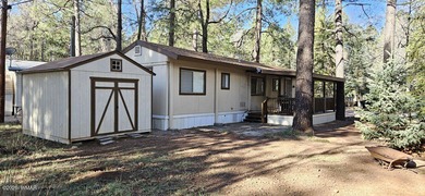 Tucked among the tall pines of Pinetop Lakes Country Club, this on Pinetop Lakes Golf and Country Club in Arizona - for sale on GolfHomes.com, golf home, golf lot