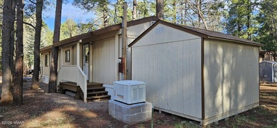 Tucked among the tall pines of Pinetop Lakes Country Club, this on Pinetop Lakes Golf and Country Club in Arizona - for sale on GolfHomes.com, golf home, golf lot