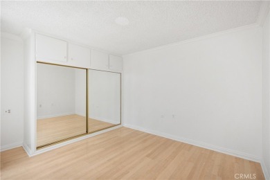 Sun-splashed Barcelona end unit with leafy outlooks, a private on Laguna Woods Village Golf Course in California - for sale on GolfHomes.com, golf home, golf lot