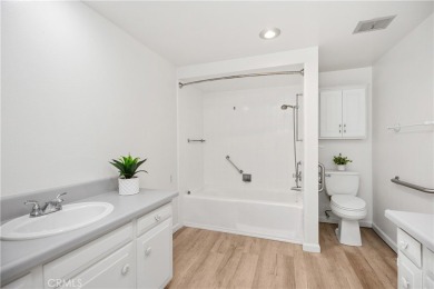 Sun-splashed Barcelona end unit with leafy outlooks, a private on Laguna Woods Village Golf Course in California - for sale on GolfHomes.com, golf home, golf lot