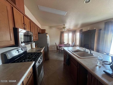 Beautiful well cared for home in White Mountain Lakes. Home come on Silver Creek Golf Club in Arizona - for sale on GolfHomes.com, golf home, golf lot