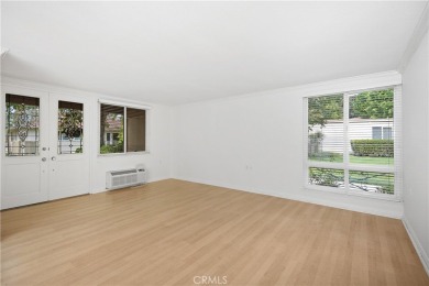 Sun-splashed Barcelona end unit with leafy outlooks, a private on Laguna Woods Village Golf Course in California - for sale on GolfHomes.com, golf home, golf lot