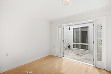 Sun-splashed Barcelona end unit with leafy outlooks, a private on Laguna Woods Village Golf Course in California - for sale on GolfHomes.com, golf home, golf lot