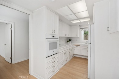 Sun-splashed Barcelona end unit with leafy outlooks, a private on Laguna Woods Village Golf Course in California - for sale on GolfHomes.com, golf home, golf lot