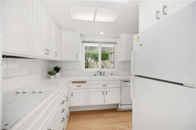 Sun-splashed Barcelona end unit with leafy outlooks, a private on Laguna Woods Village Golf Course in California - for sale on GolfHomes.com, golf home, golf lot