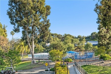 Sun-splashed Barcelona end unit with leafy outlooks, a private on Laguna Woods Village Golf Course in California - for sale on GolfHomes.com, golf home, golf lot