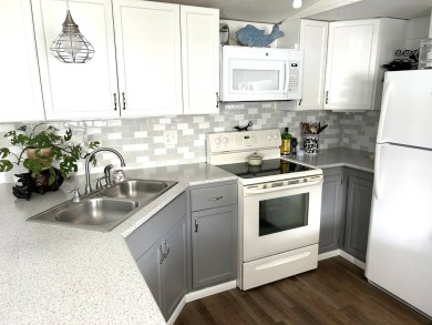 This 2-bedroom, 1-bathroom gem offers an incredible value and is on Crystal Lake Club in Florida - for sale on GolfHomes.com, golf home, golf lot