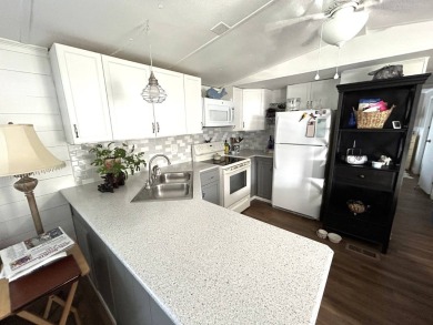 This 2-bedroom, 1-bathroom gem offers an incredible value and is on Crystal Lake Club in Florida - for sale on GolfHomes.com, golf home, golf lot