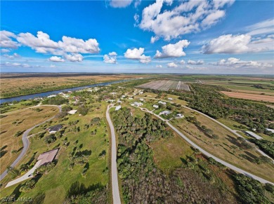 Amazing acreage in a small but beautiful Glades community near on The Glades Resort in Florida - for sale on GolfHomes.com, golf home, golf lot