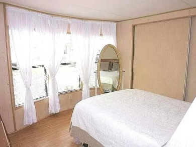 This 2-bedroom, 1-bathroom gem offers an incredible value and is on Crystal Lake Club in Florida - for sale on GolfHomes.com, golf home, golf lot