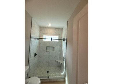Check out the private wooded view of this immensely grand home! on Myrtlewood Golf Course and Club  in South Carolina - for sale on GolfHomes.com, golf home, golf lot