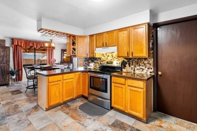 Welcome to this one-of-a-kind Santa Fe-style ranch home on Desert Hawk At Pueblo West in Colorado - for sale on GolfHomes.com, golf home, golf lot