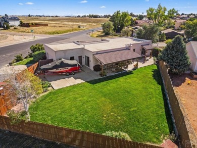 Welcome to this one-of-a-kind Santa Fe-style ranch home on Desert Hawk At Pueblo West in Colorado - for sale on GolfHomes.com, golf home, golf lot