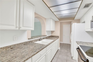 Charming 2-bed, 1-bath home on nearly half an acre (.45+/-) in on Sandridge Golf Course and Club in Florida - for sale on GolfHomes.com, golf home, golf lot