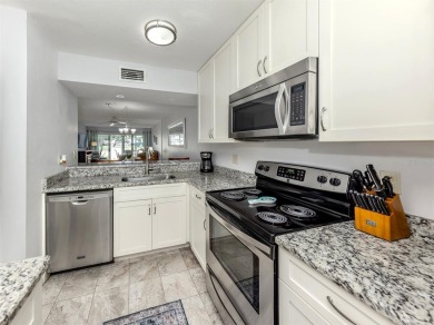 Light and bright ground floor two-bedroom, two-bath home enjoys on Plantation Golf and Country Club in Florida - for sale on GolfHomes.com, golf home, golf lot