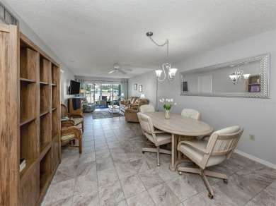 Light and bright ground floor two-bedroom, two-bath home enjoys on Plantation Golf and Country Club in Florida - for sale on GolfHomes.com, golf home, golf lot