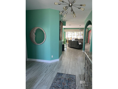 Completely remodeled home in The Peninsula Golf Resort on Peninsula Golf and Racquet Club in Alabama - for sale on GolfHomes.com, golf home, golf lot