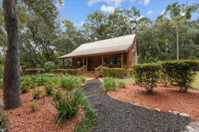 Custom Cypress Log Home Cabin located in the heart of Chiefland on Chiefland Golf and Country Club in Florida - for sale on GolfHomes.com, golf home, golf lot