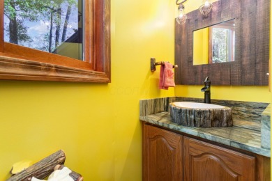 Beautifully maintained raised ranch setting above the end of a on Hide-A-Way Hills Golf Club in Ohio - for sale on GolfHomes.com, golf home, golf lot