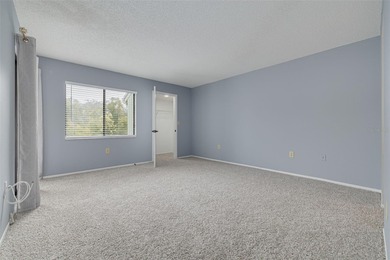 Welcome home to this beautifully updated second-floor condo on East Lake Woodlands Country Club in Florida - for sale on GolfHomes.com, golf home, golf lot