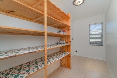Priced well below comparable homes, This charming single-level on Palmetto-Pine Country Club in Florida - for sale on GolfHomes.com, golf home, golf lot