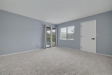 Welcome home to this beautifully updated second-floor condo on East Lake Woodlands Country Club in Florida - for sale on GolfHomes.com, golf home, golf lot