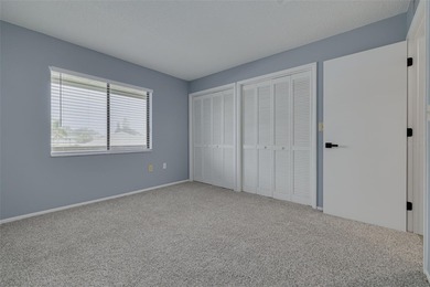 Welcome home to this beautifully updated second-floor condo on East Lake Woodlands Country Club in Florida - for sale on GolfHomes.com, golf home, golf lot