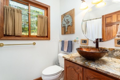Beautifully maintained raised ranch setting above the end of a on Hide-A-Way Hills Golf Club in Ohio - for sale on GolfHomes.com, golf home, golf lot