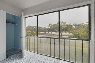 Welcome home to this beautifully updated second-floor condo on East Lake Woodlands Country Club in Florida - for sale on GolfHomes.com, golf home, golf lot