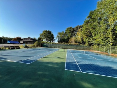 This stunning property embodies the essence of lakefront living on The Trail At Chickasaw Pointe in South Carolina - for sale on GolfHomes.com, golf home, golf lot