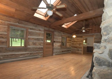 3 bedroom cabin on 4 beautiful wooded lots totaling 1.88 acres on Hide-A-Way Hills Club in Ohio - for sale on GolfHomes.com, golf home, golf lot