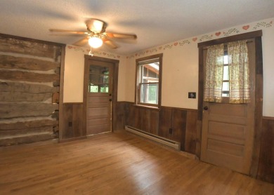 3 bedroom cabin on 4 beautiful wooded lots totaling 1.88 acres on Hide-A-Way Hills Club in Ohio - for sale on GolfHomes.com, golf home, golf lot