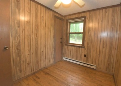 3 bedroom cabin on 4 beautiful wooded lots totaling 1.88 acres on Hide-A-Way Hills Club in Ohio - for sale on GolfHomes.com, golf home, golf lot