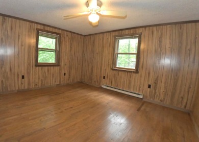 3 bedroom cabin on 4 beautiful wooded lots totaling 1.88 acres on Hide-A-Way Hills Club in Ohio - for sale on GolfHomes.com, golf home, golf lot