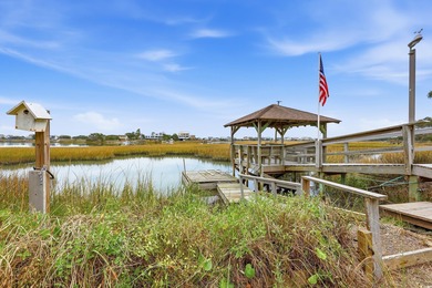 Set on a generous .44-acre homesite and positioned along one of on Pawleys Plantation Golf and Country Club in South Carolina - for sale on GolfHomes.com, golf home, golf lot