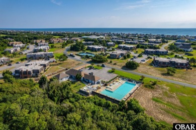 Experience coastal living at its finest in this beautifully on Seascape Golf Links in North Carolina - for sale on GolfHomes.com, golf home, golf lot