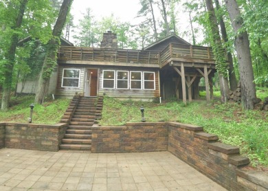 3 bedroom cabin on 4 beautiful wooded lots totaling 1.88 acres on Hide-A-Way Hills Club in Ohio - for sale on GolfHomes.com, golf home, golf lot