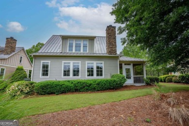 Welcome to this charming 3-bedroom, 3.5-bathroom Landing cottage on Reynolds Lake Oconee - The Landing in Georgia - for sale on GolfHomes.com, golf home, golf lot